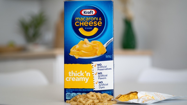 A box of Kraft Mac & Cheese sits on a counter