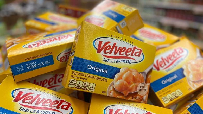 Boxes of Velveeta cheese are piled onto each other