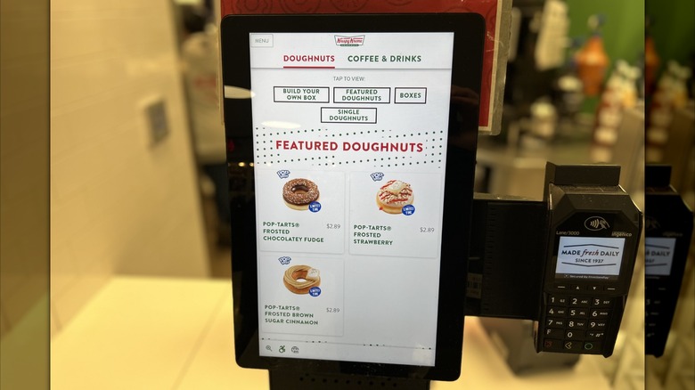 ordering Krispy Kreme x Pop-Tarts doughnuts from a kiosk