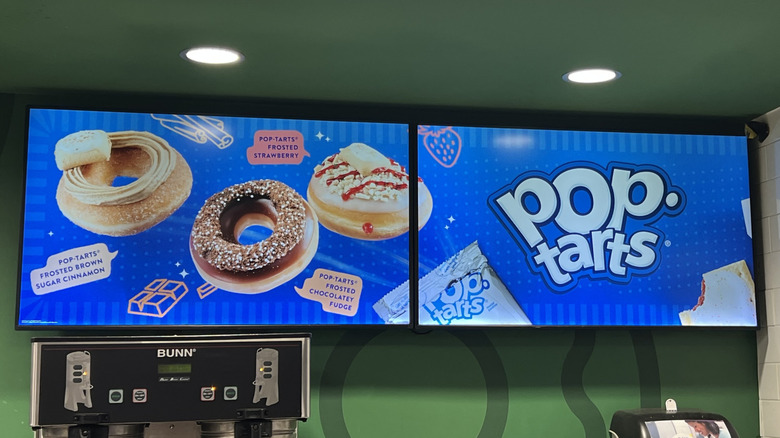 TV screens displaying the Krispy Kreme x Pop-Tarts Doughnut