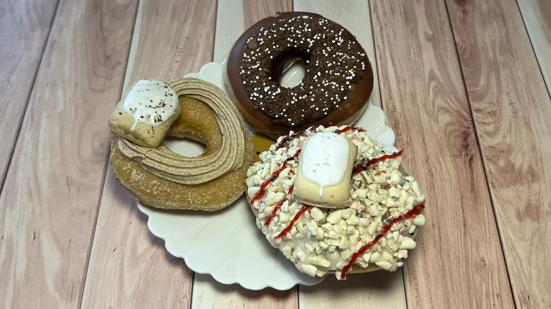 a plate with all 3 Krispy Kreme x Pop-Tarts Doughnuts