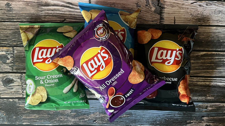 a bag of Lay's All Dressed stacked on three other flavors