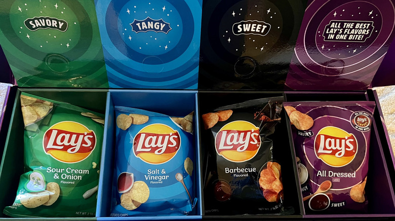 four different flavor bags of Lay's chips