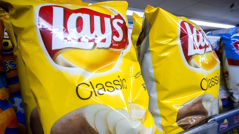 Bags of Lay's potato chips on display at the store