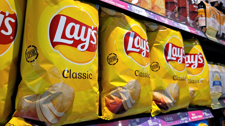 An image of Lay's Classic Potato Chips on a supermarket shelf.