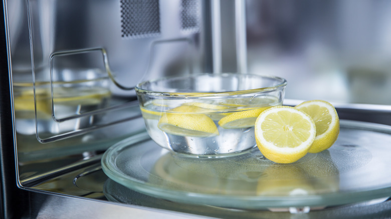 lemons in bowl of water used to clean inside of microwave