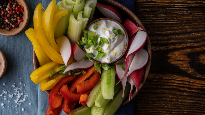 Crudités platter with creamy dip, salt, and pepper