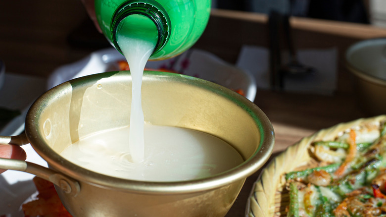 Makgeolli being poured into a bowl.