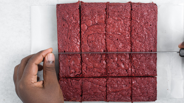 Slicing red velvet brownies