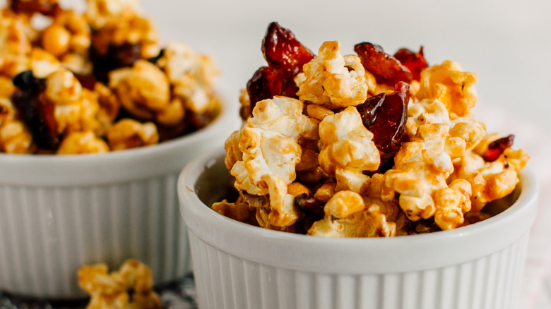 Maple bacon fresh popped popcorn in two white ramekins