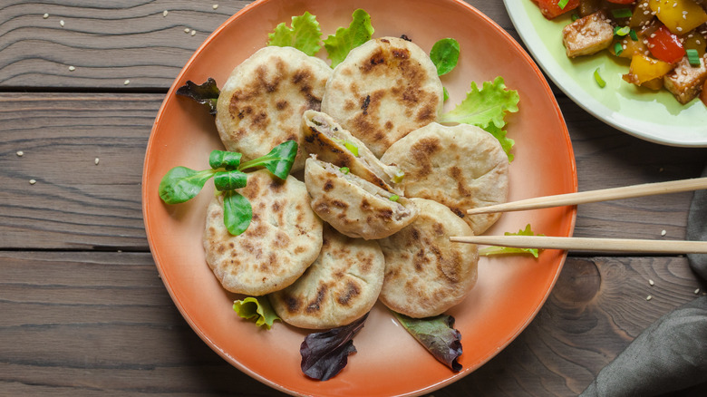 Asian-style stuffed pancakes on plate