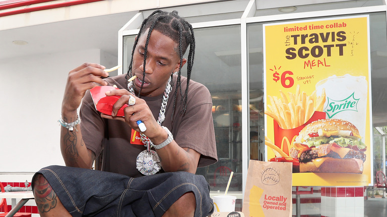 Travis Scott is seen eating McDonald's French fries