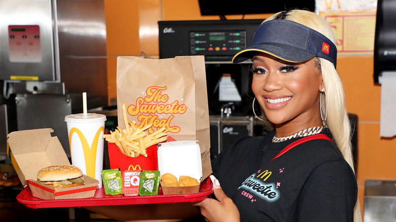 Saweetie holding her McDonald's meal