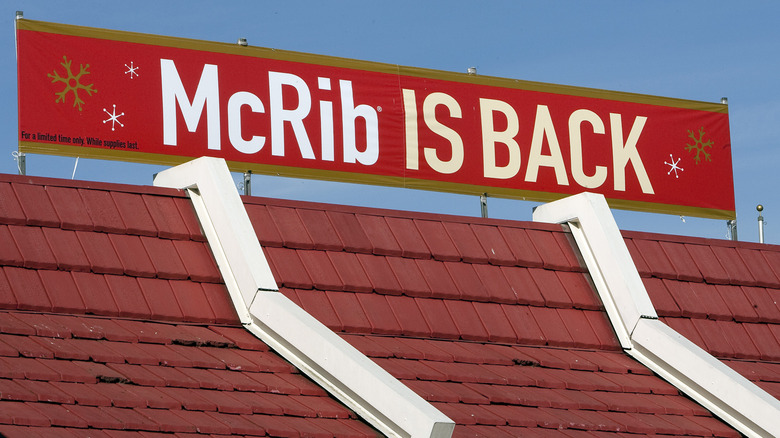 The roof of a McDonald's restaurant with a red banner that says "McRib is Back" on it