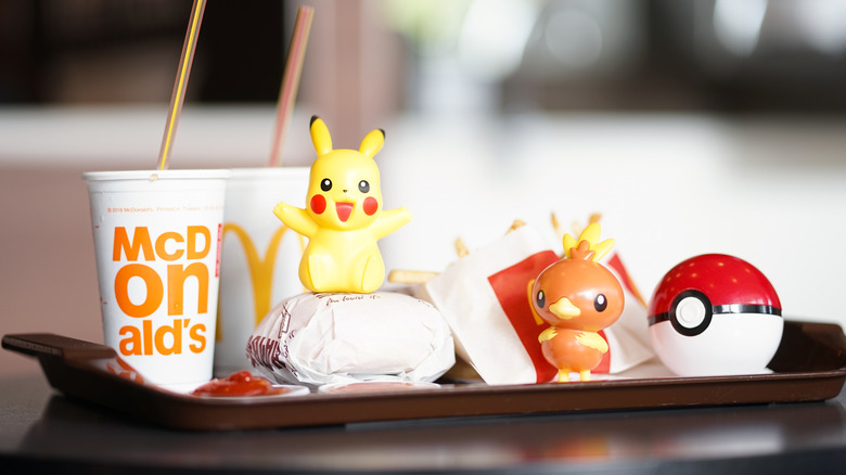 Pokemon plastic toys on McDonald's food tray