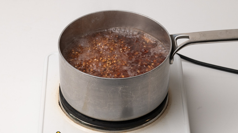 buckwheat cooking in saucepan