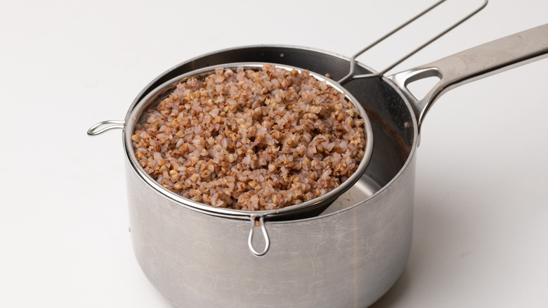 cooked buckwheat in sieve