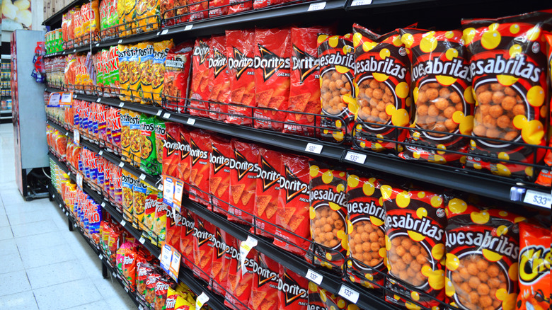 Supermarket shelves of Doritos and other chips made by Sabritas