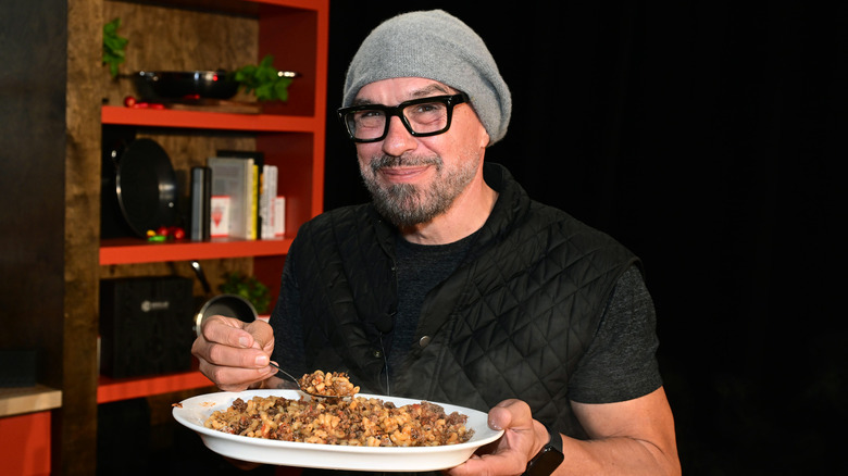 Michael Symon serving food