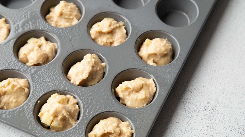 Unbaked dough in mini muffin tin