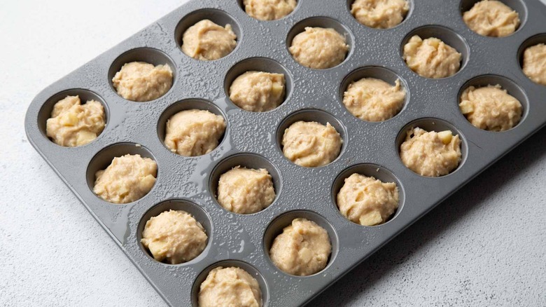 Unbaked dough in mini muffin tin