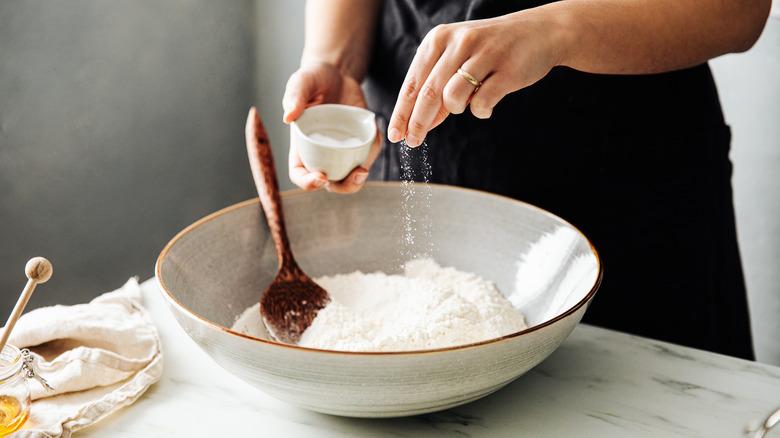 adding salt to dough