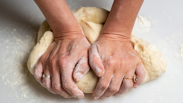 woman kneading dough