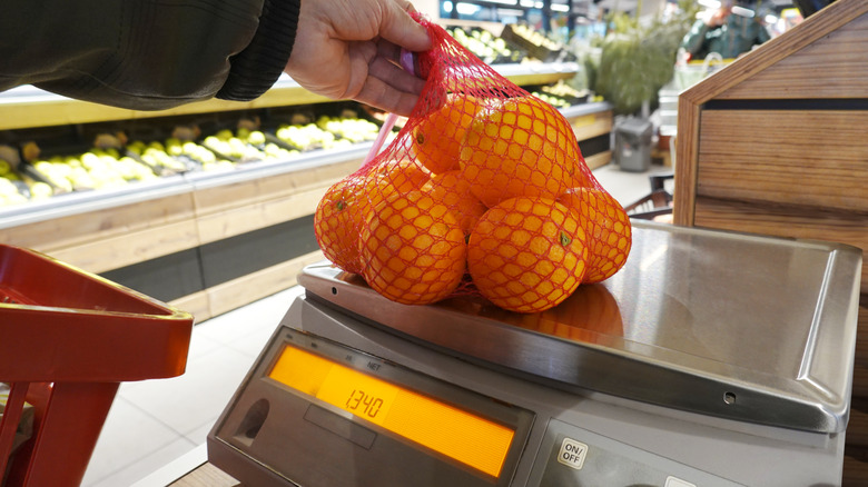 oranges in bag on scale