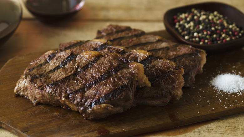 Cooked steak on a wooden board