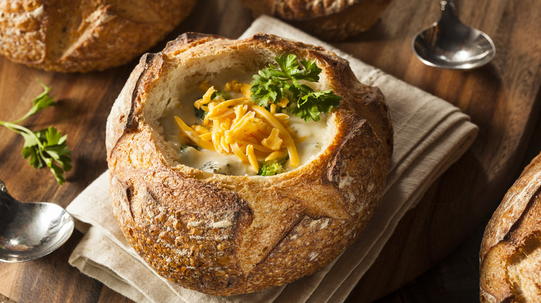 Broccoli and cheese soup in a bread bowl