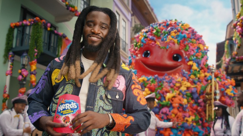 Recording Artist Shaboozey alongside the Nerds Gummy in a Nerds Gummy Cluster ad.