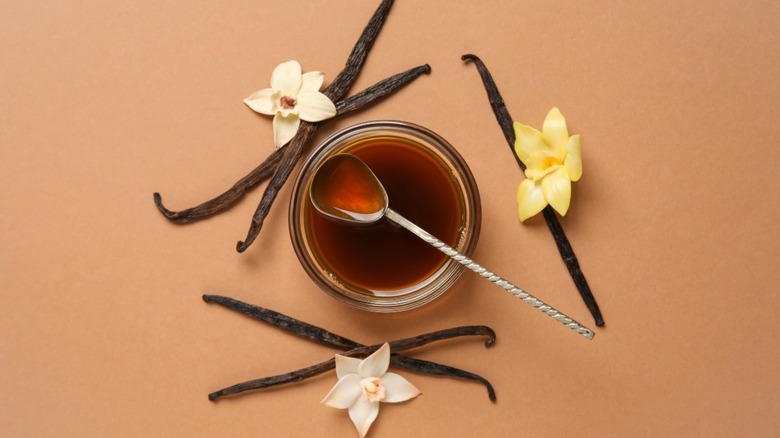 Jar of vanilla extract with vanilla beans