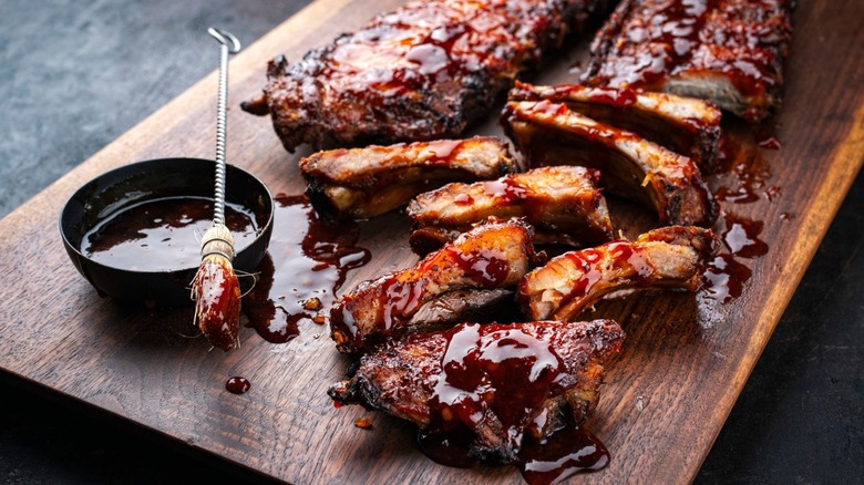 Ribs with bbq sauce on a board