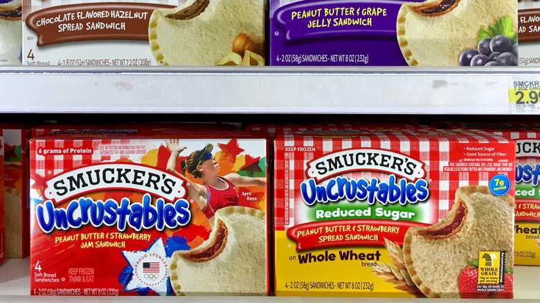 Packs of Uncrustables in a grocery store freezer case