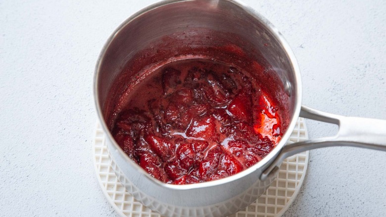 mashed cooked strawberries in a saucepan