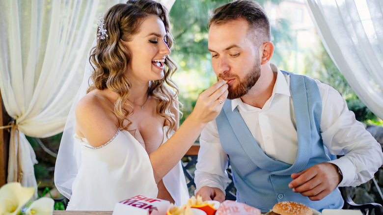 marrie couple eating fast food