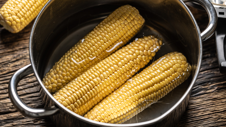 corn on the cob in pot of water