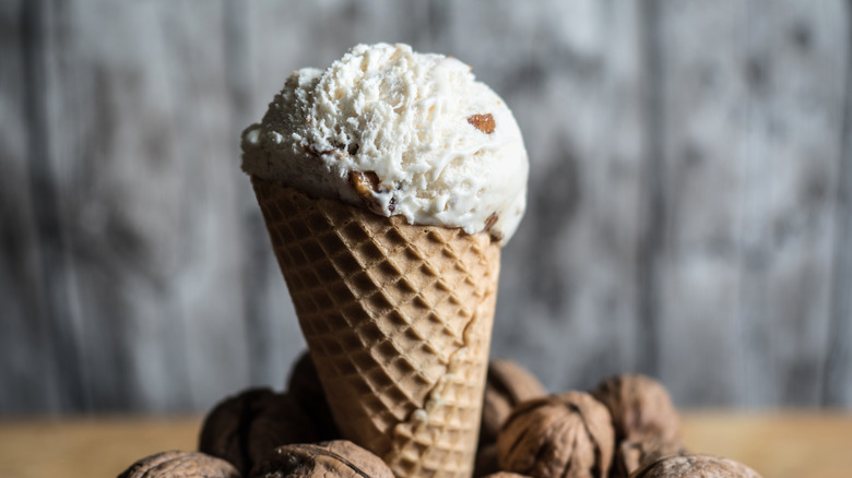 ice cream cone surrounded by walnuts