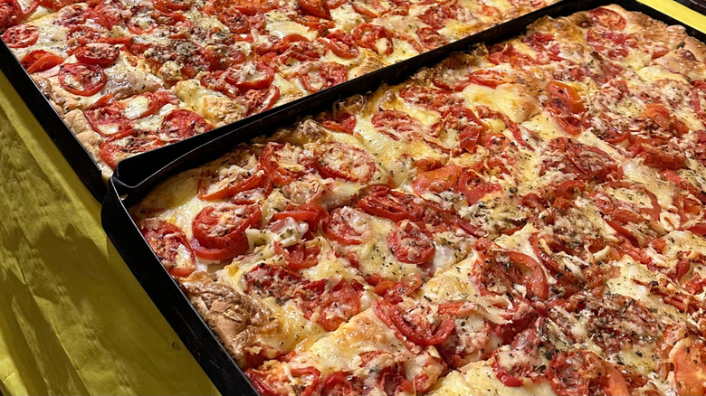 Trays of sfincione pizza