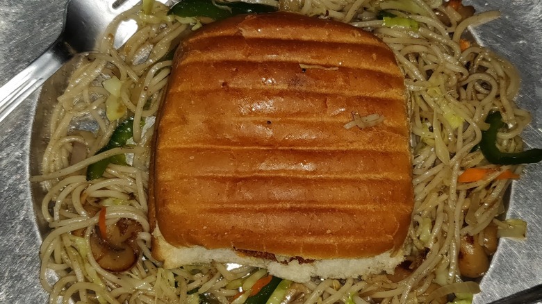 Chow mein sandwich with bread on top