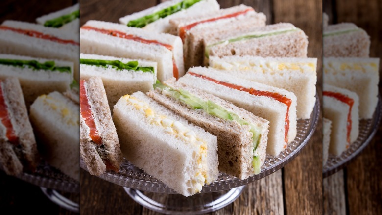 Various finger tea sandwiches on silver platter