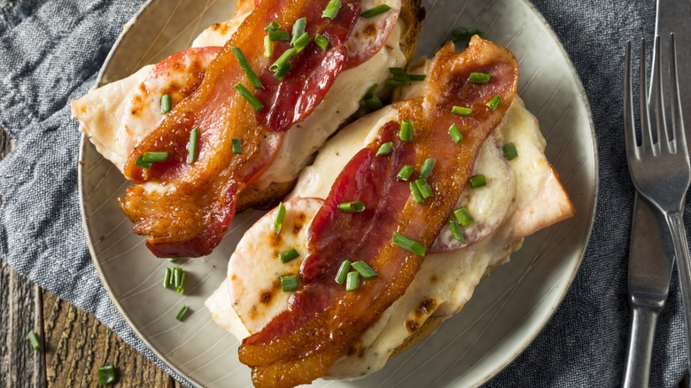 Two open faced hot brown sandwiches on a plate