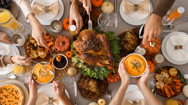 An overhead shot of a group of people serving Thanksgiving dinner