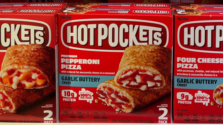 Boxes of Hot Pockets lined up at the grocery store.