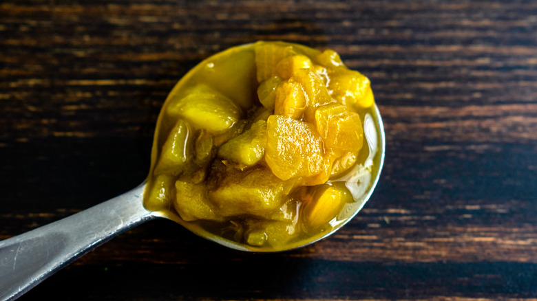 Close-up of a spoonful of canned Hatch green chiles