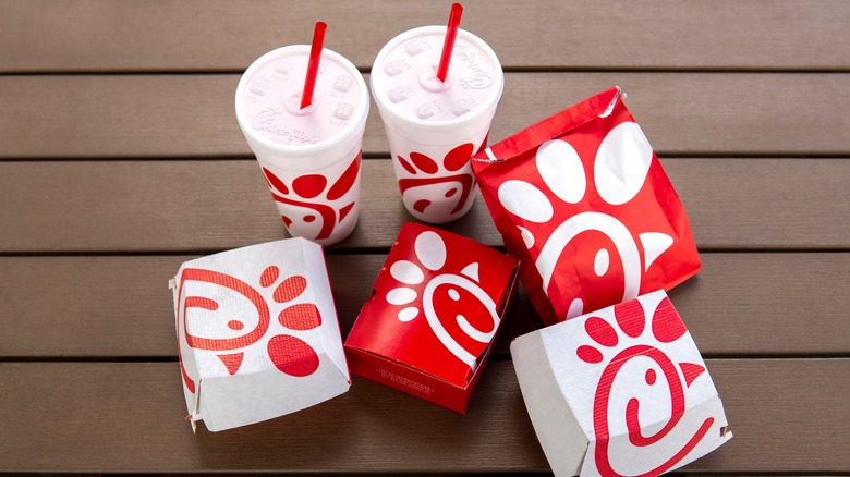 Drinks and food on a table in Chick-fil-A packaging