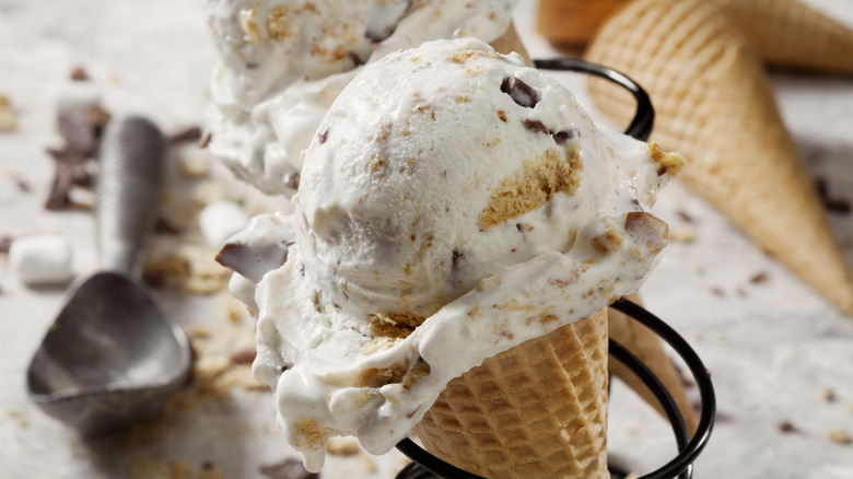 A scoop of cookie dough ice cream in a cone