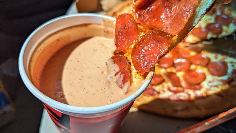 pizza dipped in cane's sauce