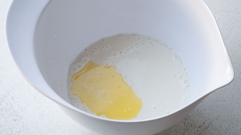 Melted butter and milk in bowl