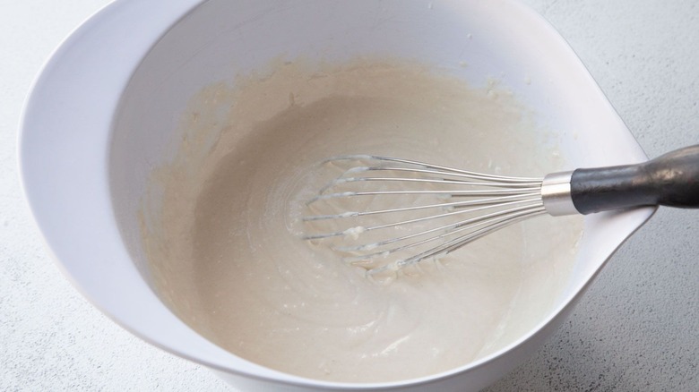 Pancake batter and whisk in bowl